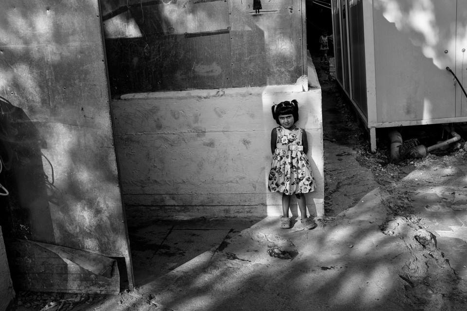 A girl inside the refugee camp Moria, Lesbos, Greece